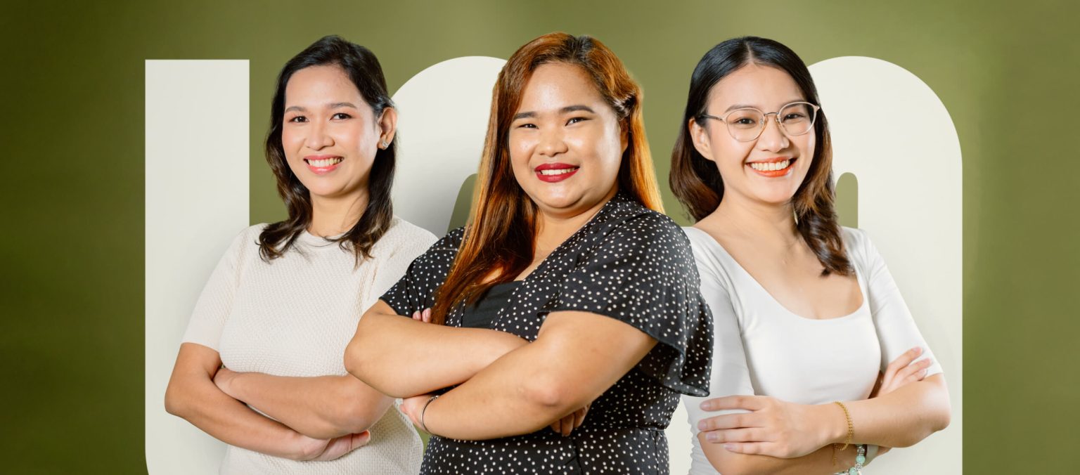 Three women standing side by side against a green background with large white text, all smiling and facing the camera with arms crossed.